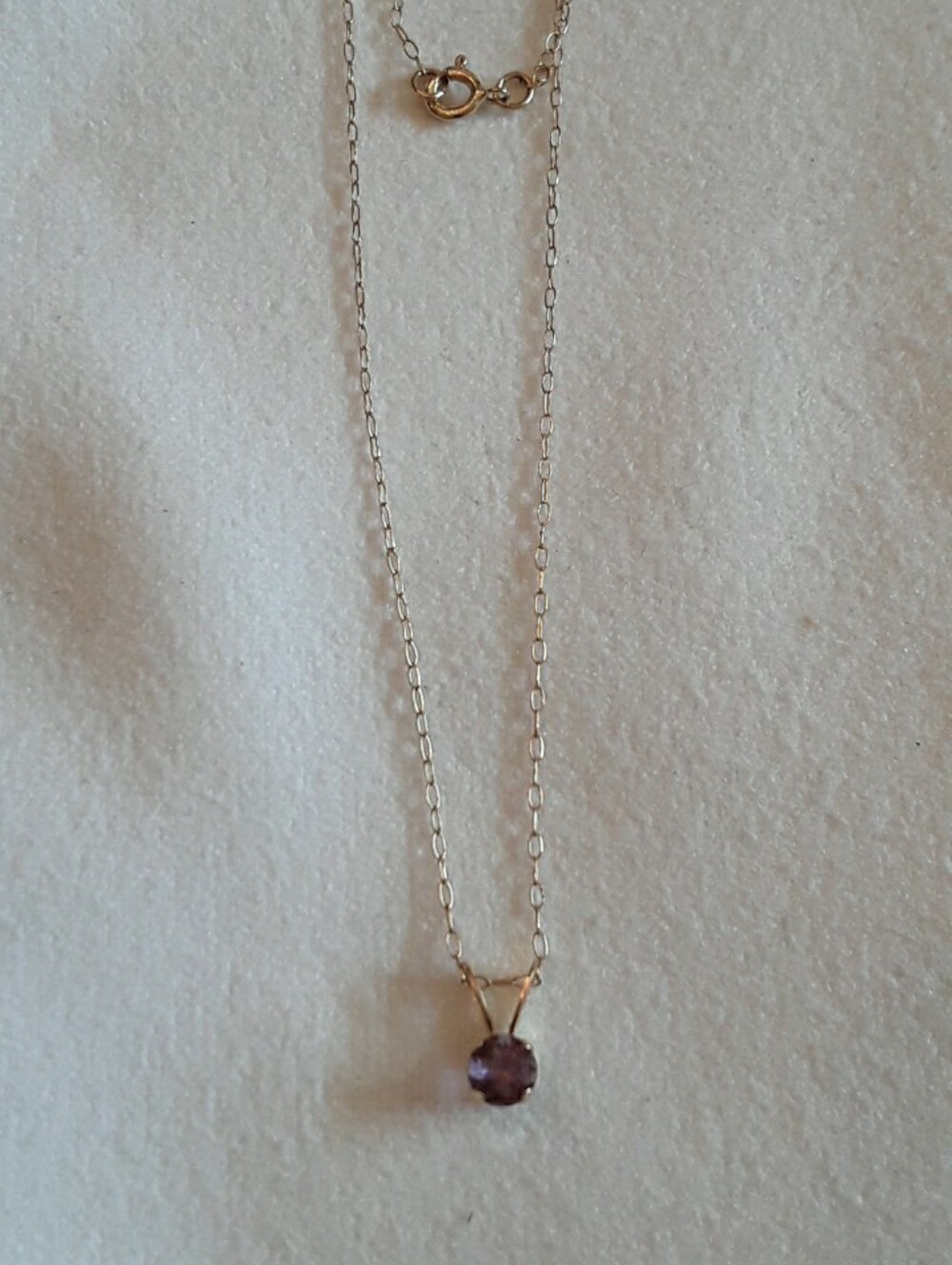 14K solid gold small amethyst pendant on a 14k solid gold chsin
